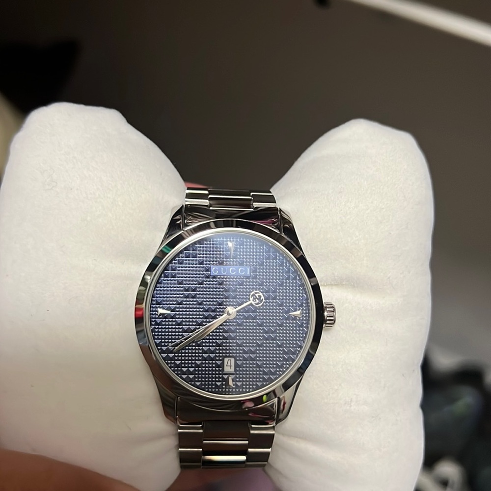 Gucci watch took a few links off but I still have them used about two times